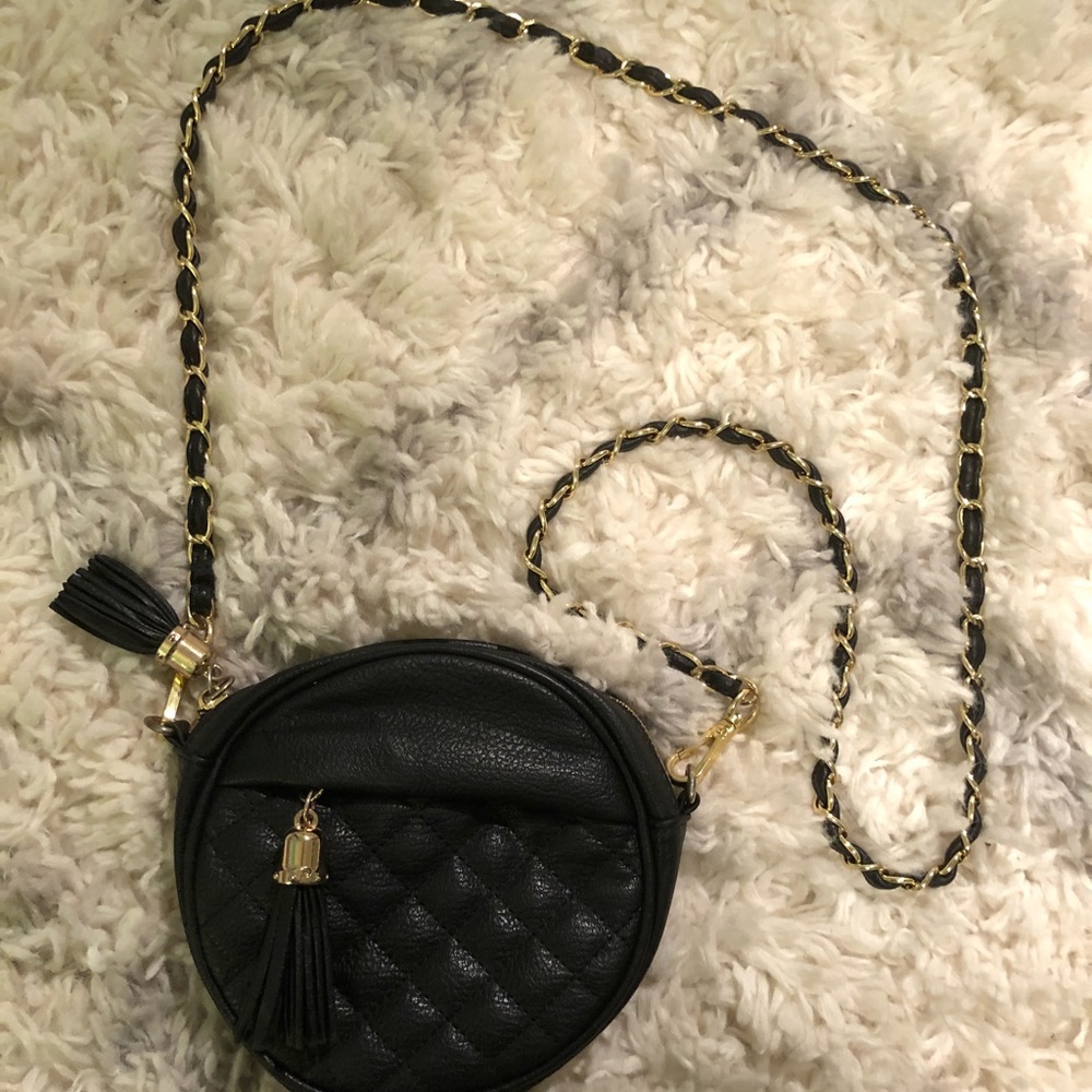 Black and gold across the shoulder purse
